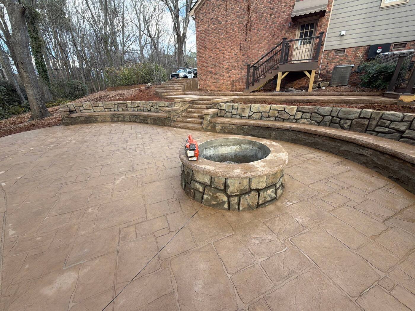 Custom concrete seat wall around an outdoor living area